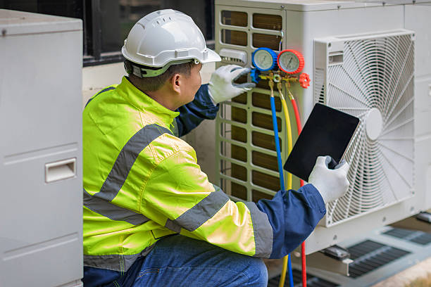 Professional Heat Pump Repair technician working in Perry, MI